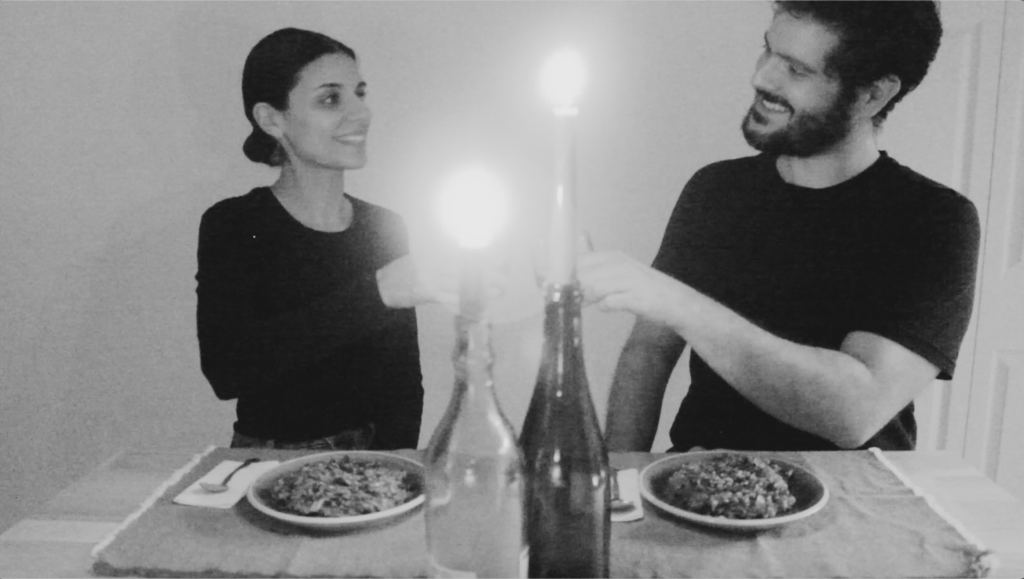 a supportive couple enjoying a meal they cooked together