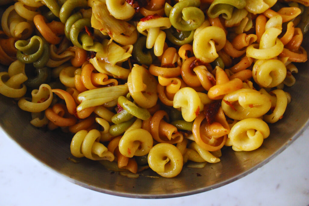 image of lemon sun-dried tomato pasta with artichoke hearts