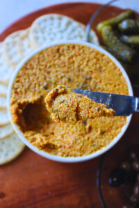 overhead image of carrot cashew spread with crackers