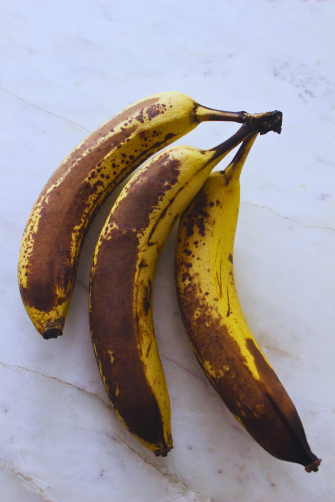 overhead image of three over ripe bananas, perfect for banana bread