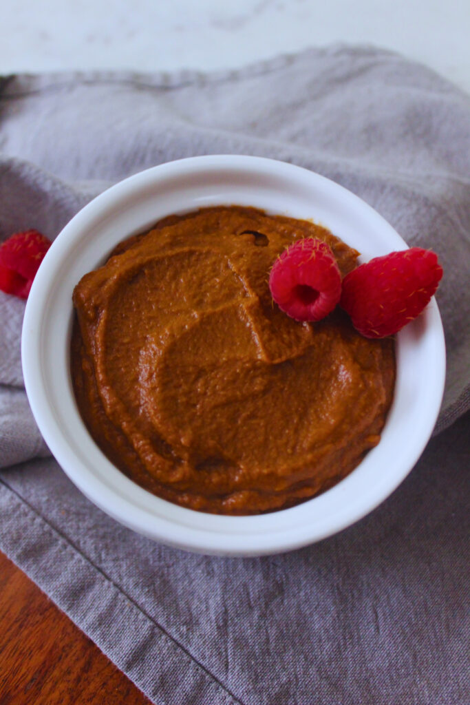 sweet potato chocolate pudding topped with raspberries