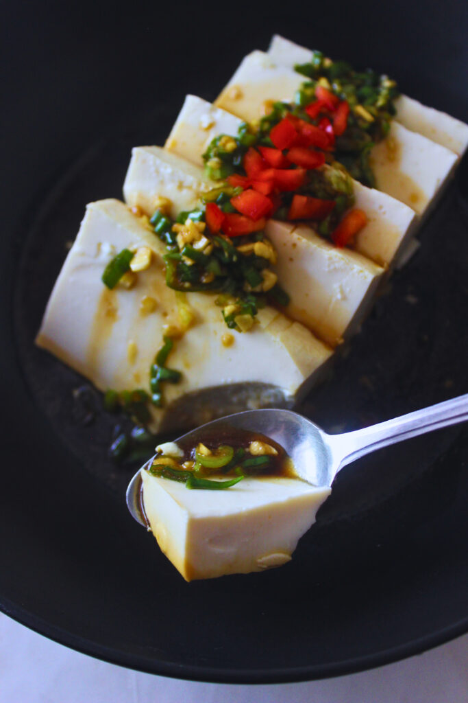 image of silken tofu and sauce recipe with a spoonful bite