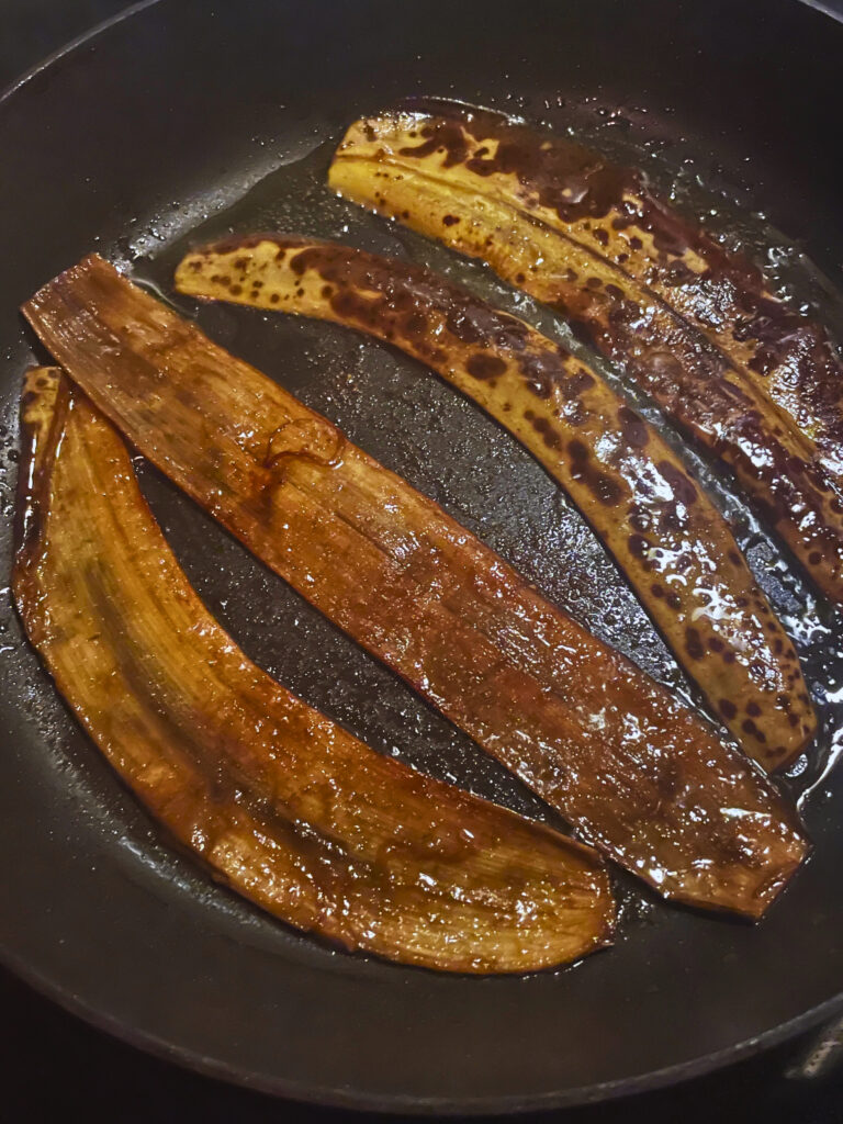 Image of frying banana peel bacon