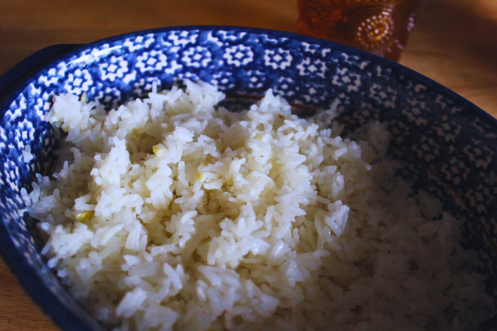 Image: Light and Fluffy white rice in a blue ceramic container