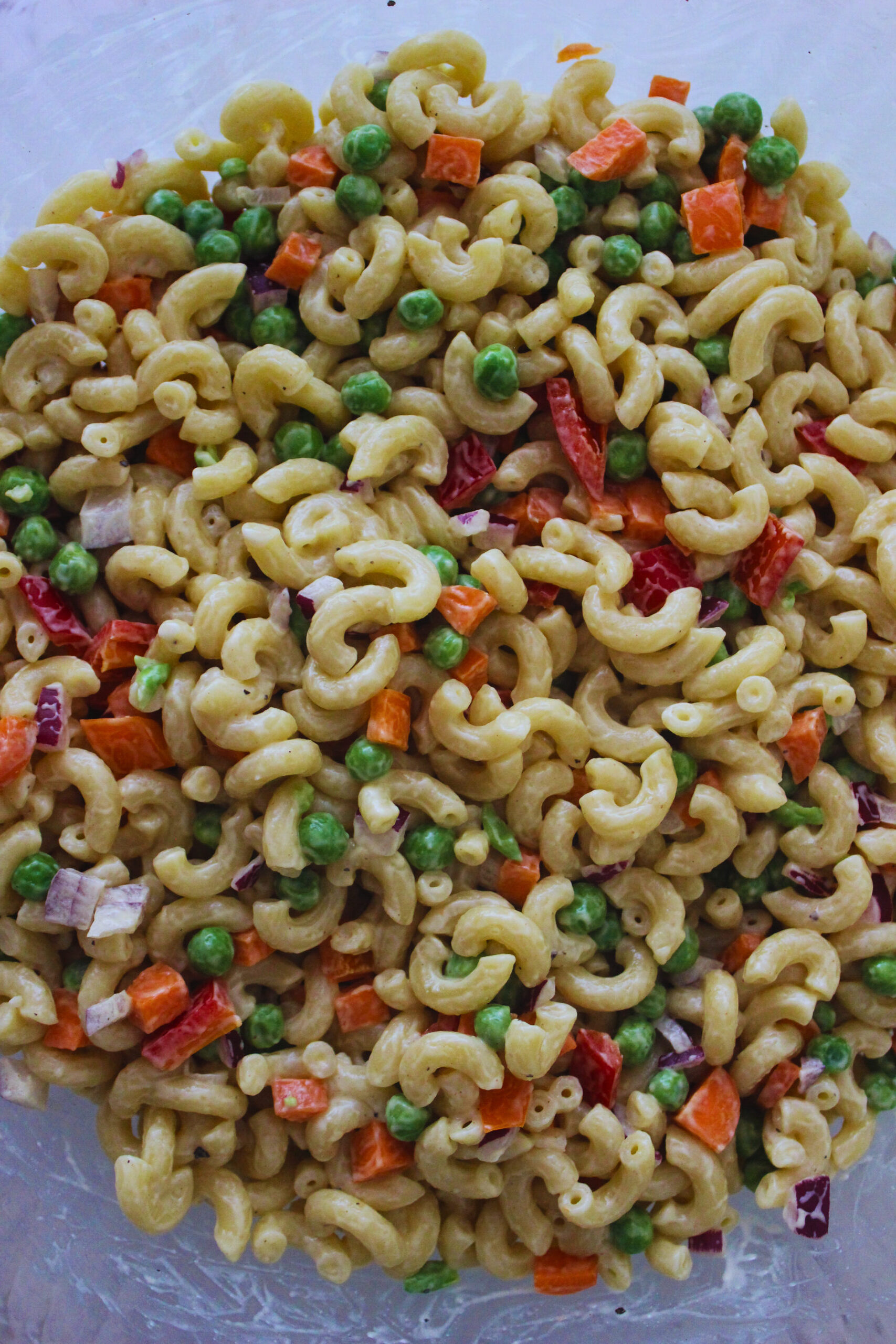 Image of macaroni salad with peas, carrots, and peppers