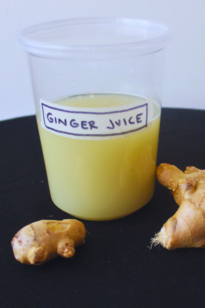 Image of juiced ginger and pieces of fresh ginger