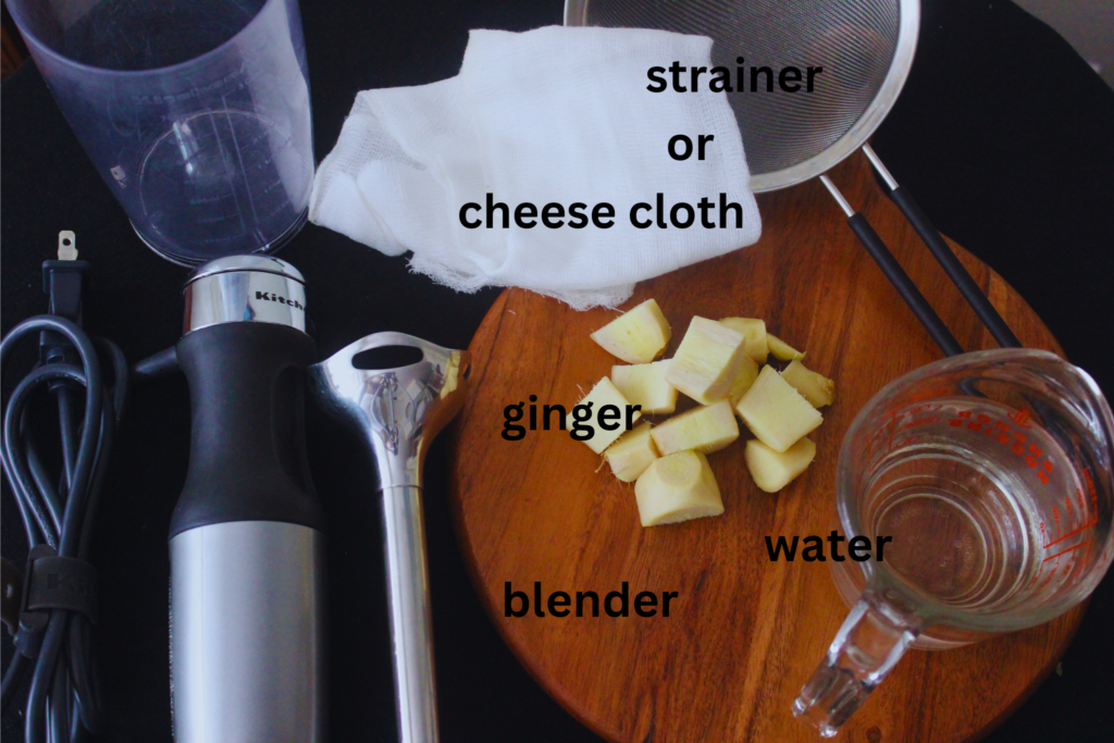 Overhead Image: Strainer, cheese cloth, ginger, water, immersion blender