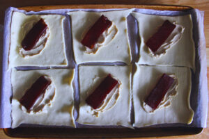 image of pastry dough filled with cream cheese and guava jelly