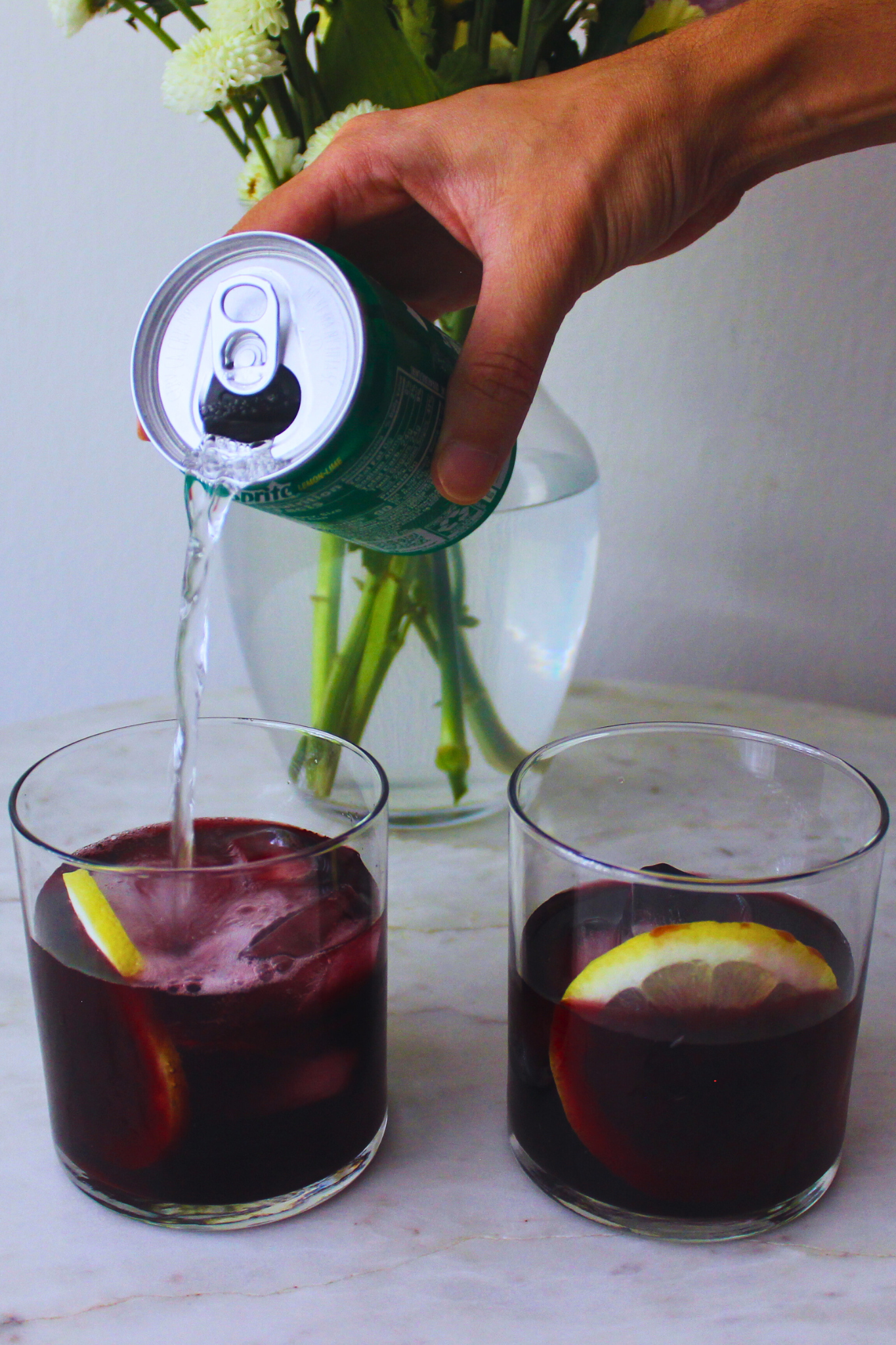 image of two glasses being served with a lemon ring