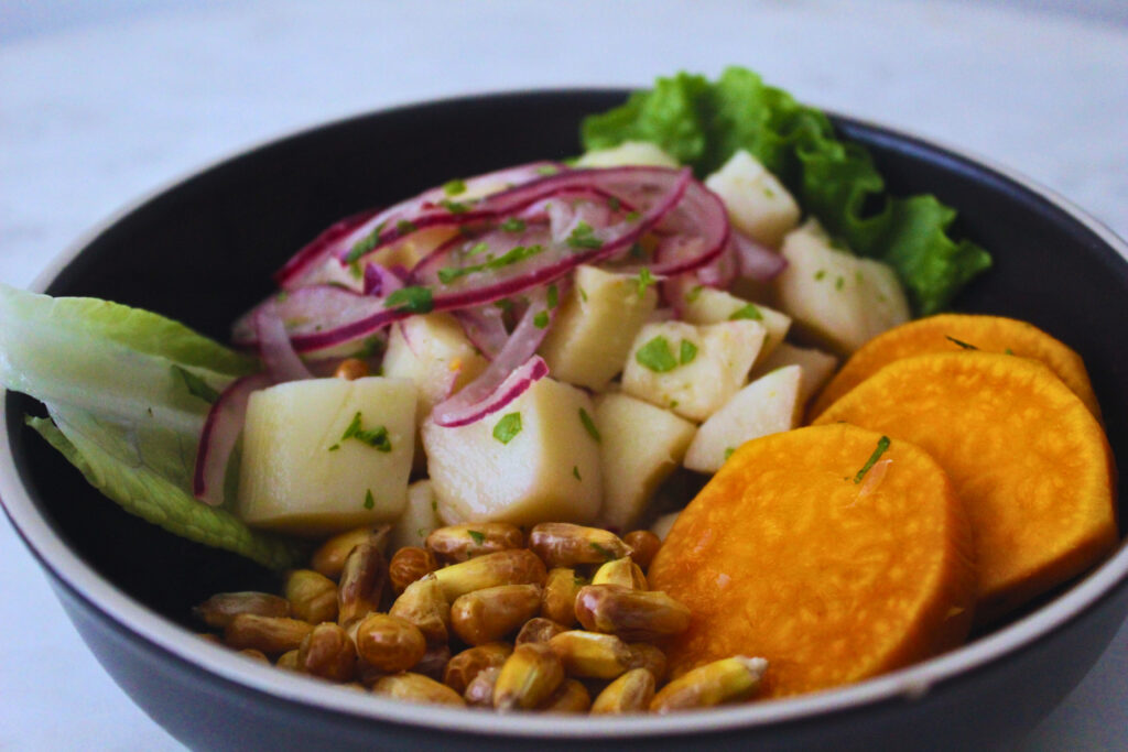 image of Peruvian ceviche made with heart of palms and served with canchitas and sweet potato