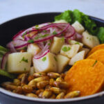 image of Peruvian ceviche made with heart of palms and served with canchitas and sweet potato