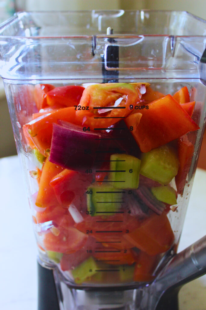 chopped gazpacho ingredients in high speed blender