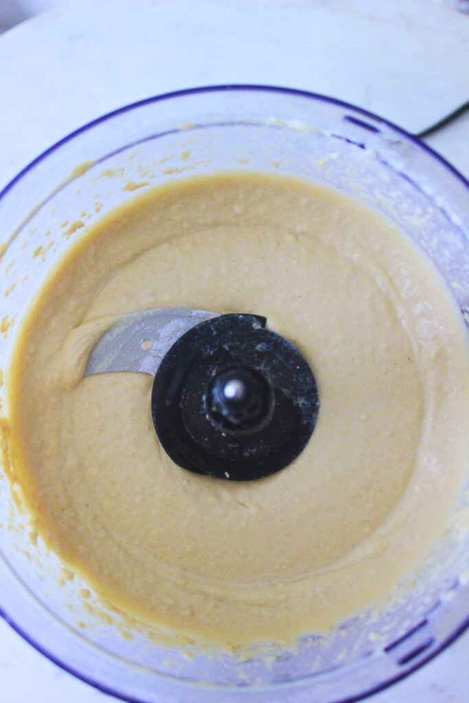 Overhead image of hummus in food processor