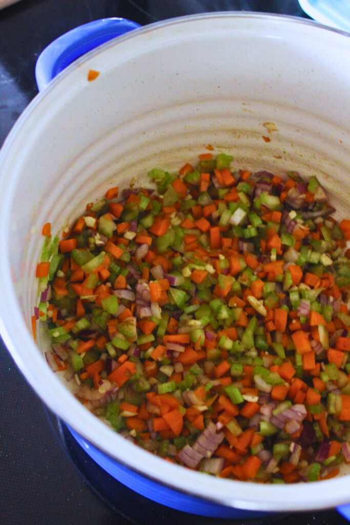 sauteing carrots, celery, onion and garlic in pot