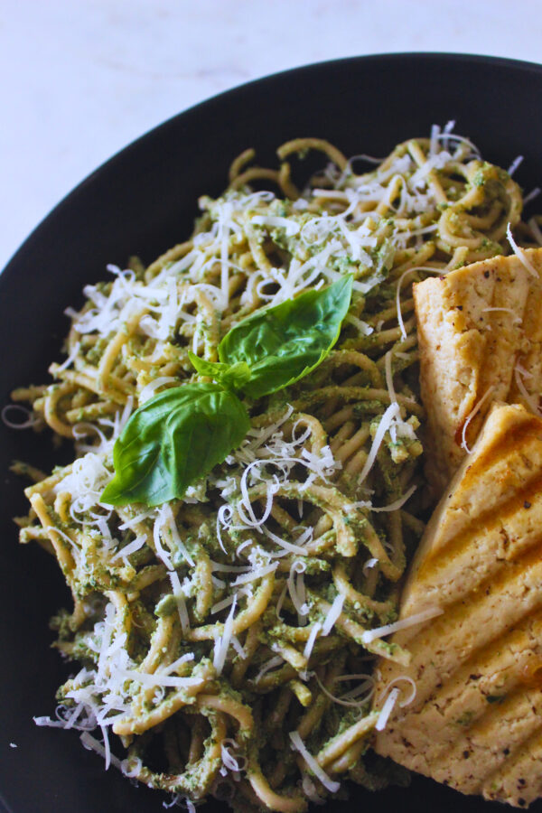 image of Peruvian green noodle pesto with side of tofu a la plancha