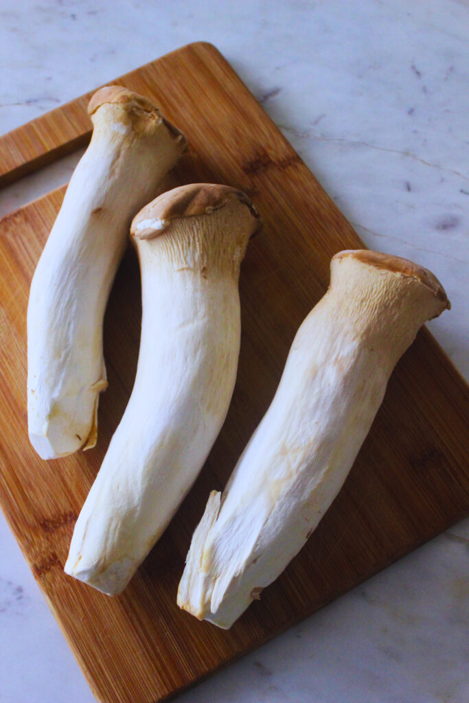 image of three large king oyster mushrooms