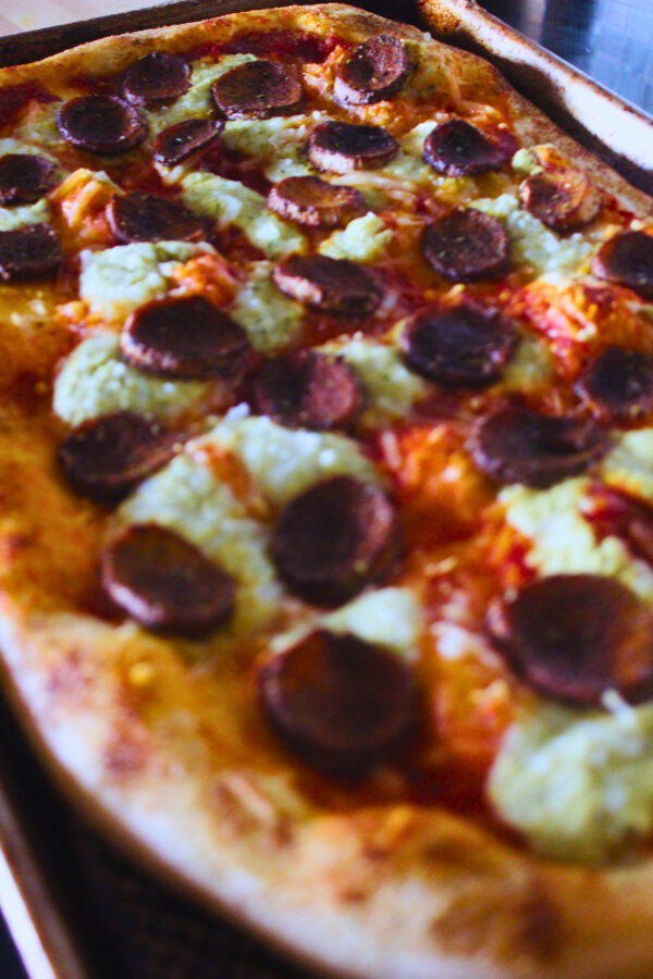 image of a vegan pizza topped with king oyster mushroom pepperoni