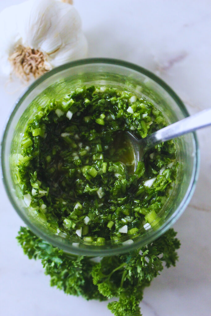 prepared parsley sauce in glass container