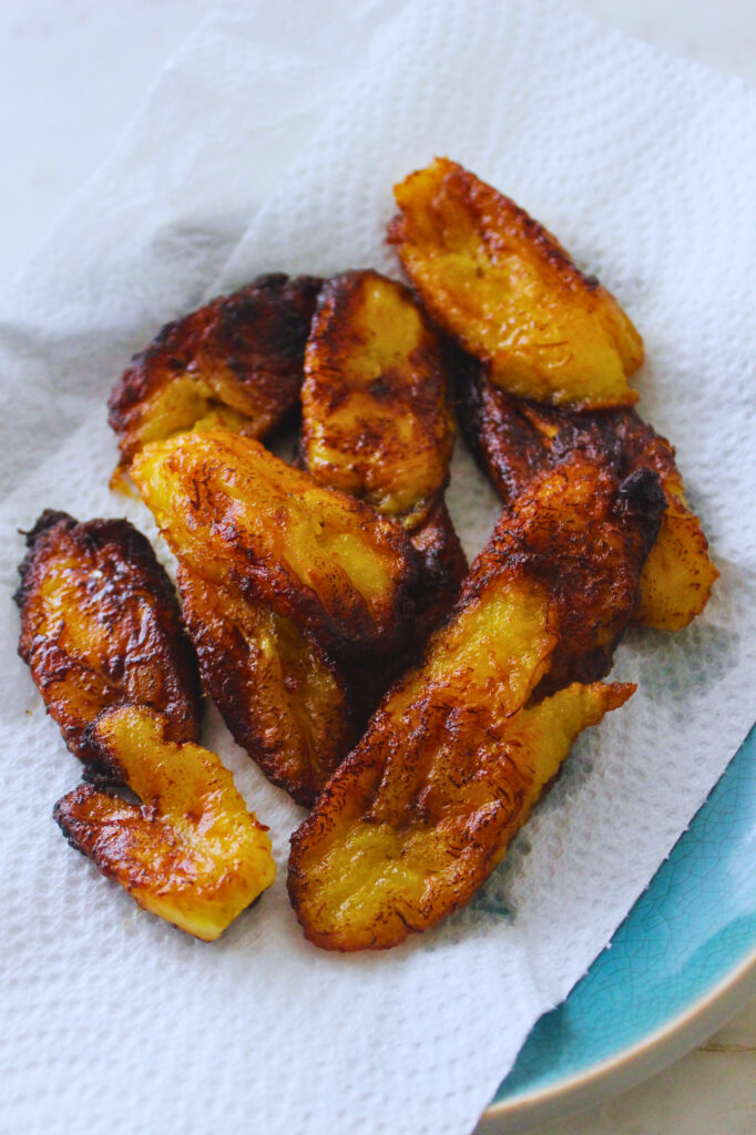 image of fried sweet plantains on paper towels to soak up excess oil