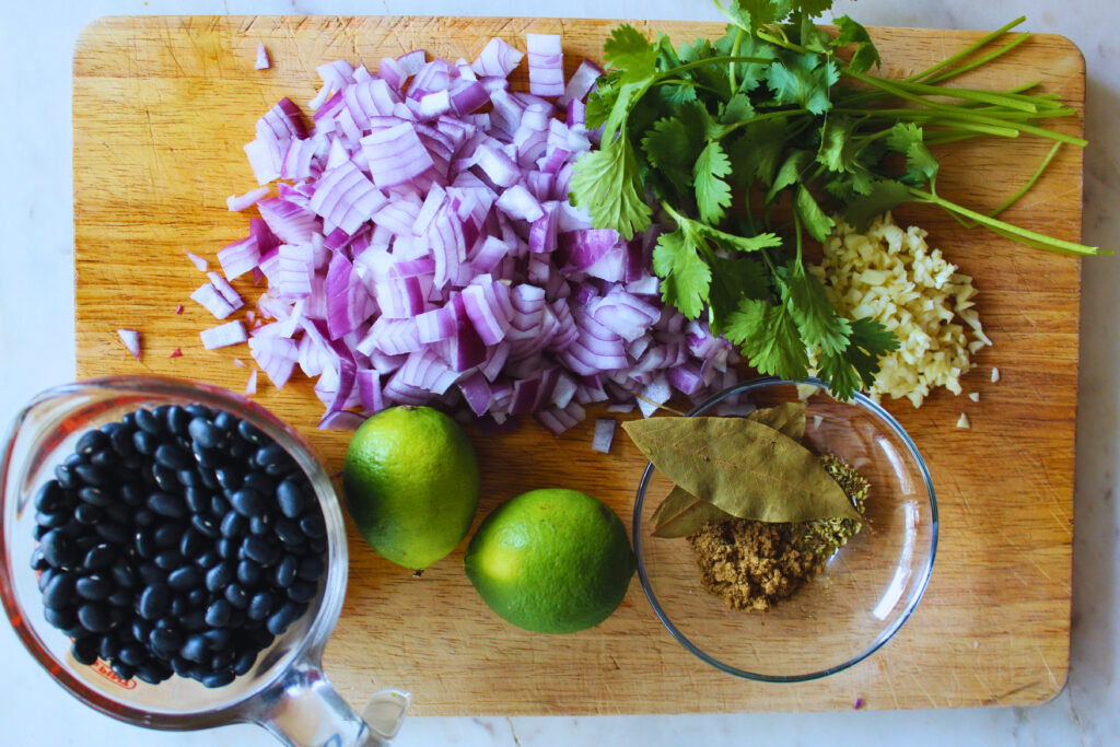 overhead image of all ingredients to make Cuban black beans