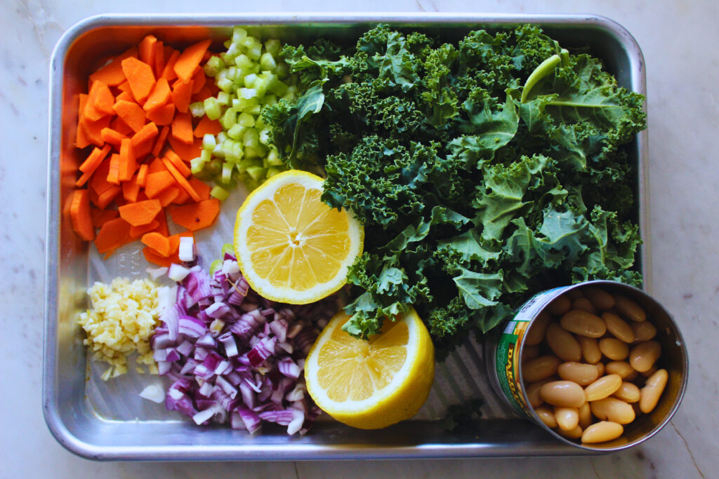 overhead image of all ingredients prepared for lemony kale white bean soup