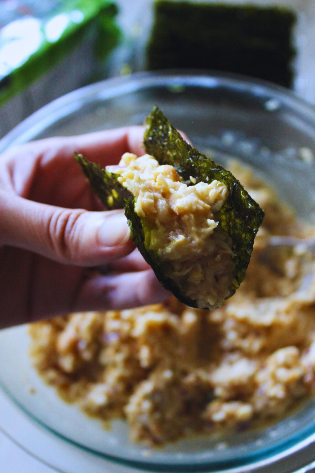 hand holding a creamy chickpea seaweed bite