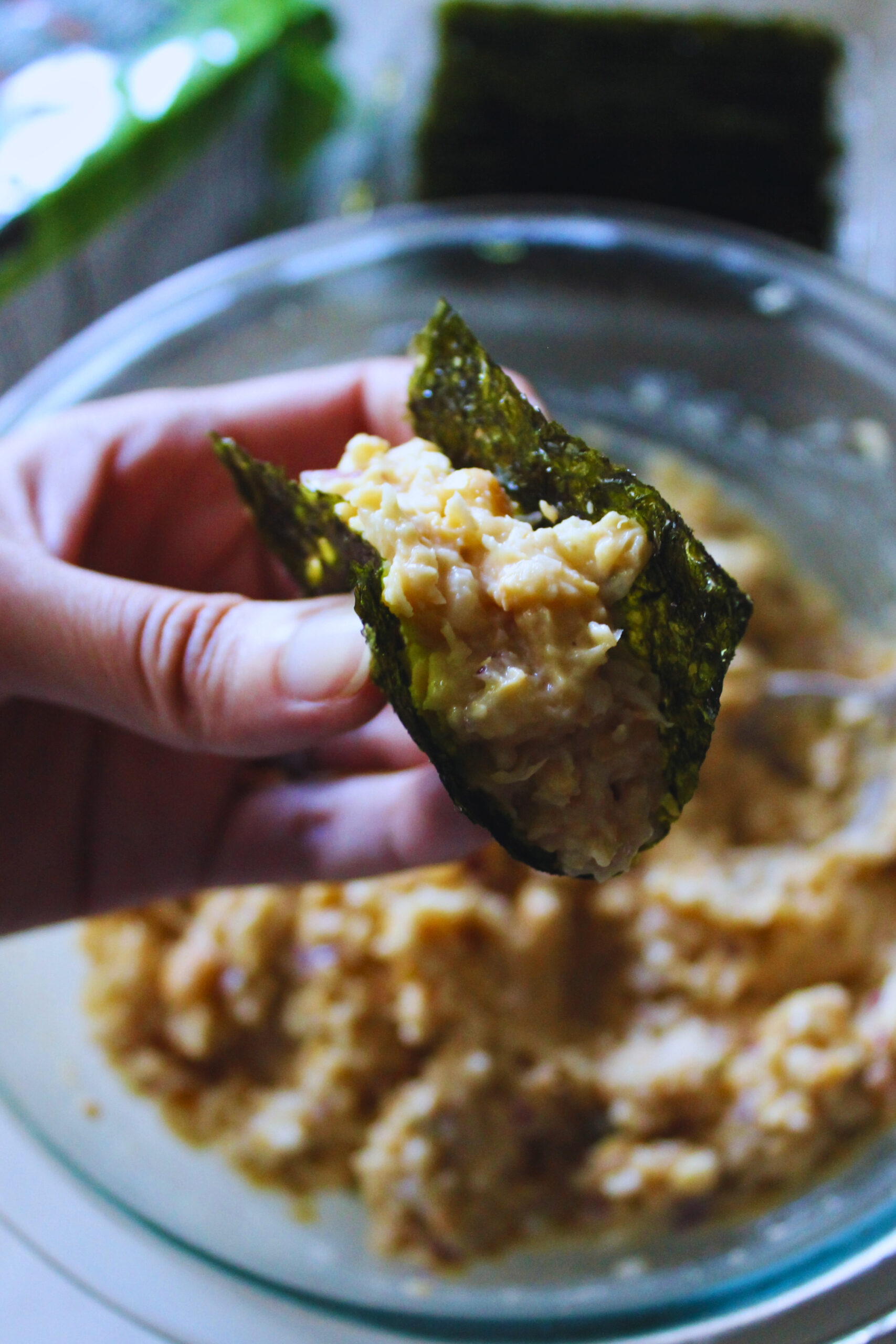 hand holding a creamy chickpea seaweed bite